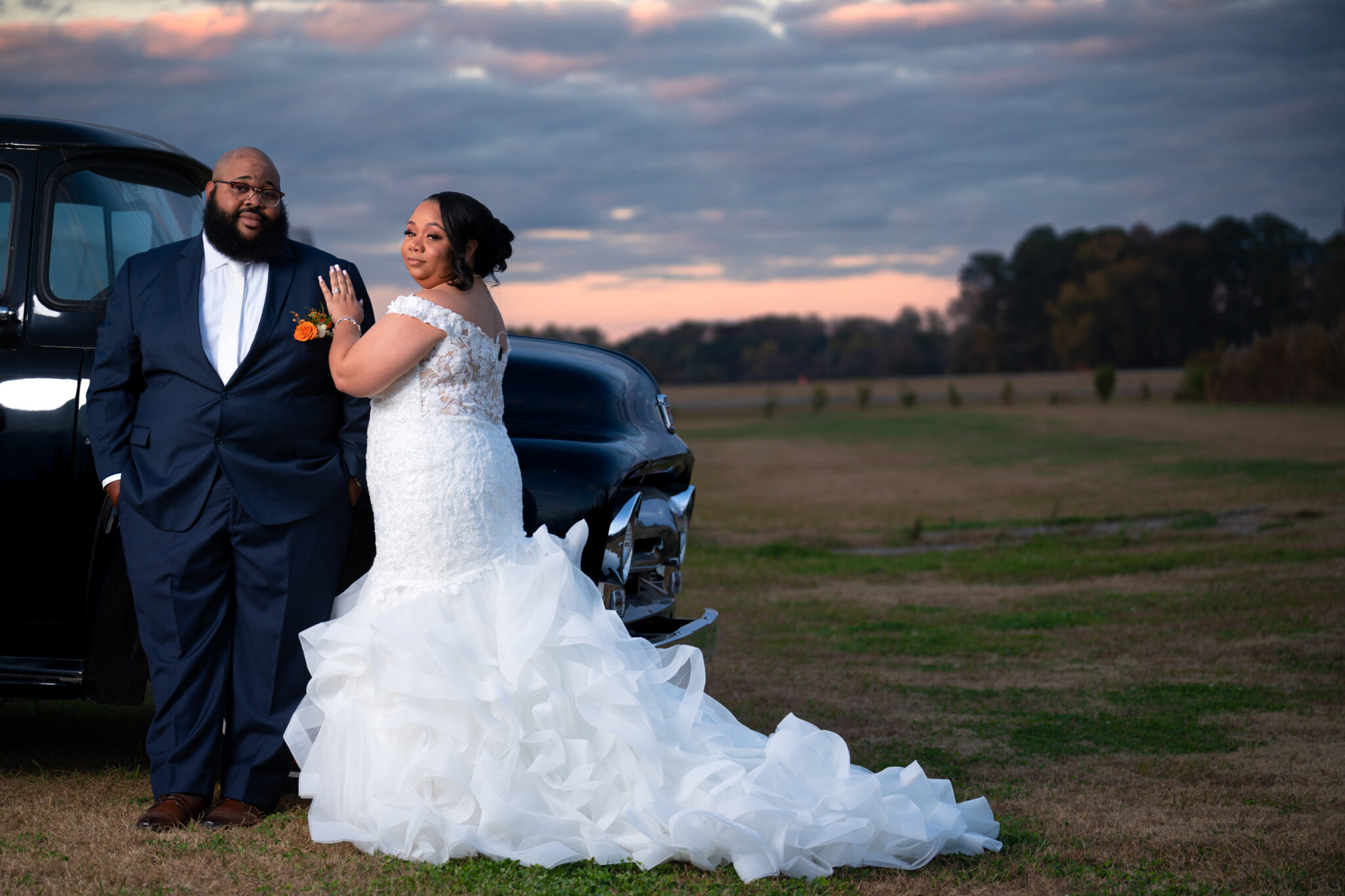 bride and groom at the cotton barn outdoors sunset. Wedding photographer & videographer, located in greenville, nc.
